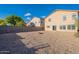 A large backyard with desert landscaping and view of neighboring homes at 30944 N Bramwell Ave, San Tan Valley, AZ 85143