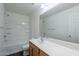 Bathroom featuring a vanity, large mirror, and a shower-tub combo with white tile at 30944 N Bramwell Ave, San Tan Valley, AZ 85143