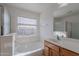 Bathroom featuring a vanity, large soaking tub, and a combined shower at 30944 N Bramwell Ave, San Tan Valley, AZ 85143