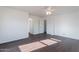 Bedroom with hardwood floors, neutral paint, and ensuite bathroom with walk-in closet access at 30944 N Bramwell Ave, San Tan Valley, AZ 85143