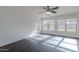 Spacious bedroom with hardwood floors, ceiling fan, and lots of natural light at 30944 N Bramwell Ave, San Tan Valley, AZ 85143