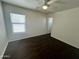 Bedroom with laminate flooring, large windows, and neutral colors at 30944 N Bramwell Ave, San Tan Valley, AZ 85143