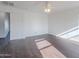 Well-lit bedroom boasts hardwood floors, neutral paint, and a modern ceiling fan at 30944 N Bramwell Ave, San Tan Valley, AZ 85143