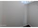 Walk-in closet with modern dark wood-look flooring and white walls at 30944 N Bramwell Ave, San Tan Valley, AZ 85143