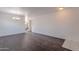 Open living area featuring dark floors, neutral walls, and classic chandelier at 30944 N Bramwell Ave, San Tan Valley, AZ 85143