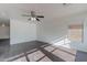 Inviting living room with wood floors, ceiling fan, and natural light at 30944 N Bramwell Ave, San Tan Valley, AZ 85143