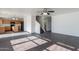 Open concept living space with wood floors, staircase, and easy kitchen access at 30944 N Bramwell Ave, San Tan Valley, AZ 85143