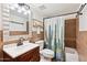 Updated bathroom with a cactus-themed shower curtain and modern vanity at 3314 N 68Th St # 129, Scottsdale, AZ 85251