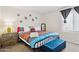 Bright bedroom featuring metal bed frame, colorful bedding, and tufted bench at 3314 N 68Th St # 129, Scottsdale, AZ 85251
