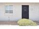 Front door with security screen and house number, surrounded by desert landscape at 3314 N 68Th St # 129, Scottsdale, AZ 85251
