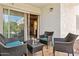 Relaxing outdoor patio featuring wicker furniture and sliding glass doors at 3314 N 68Th St # 129, Scottsdale, AZ 85251