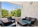 Inviting patio area with comfortable wicker seating and lush green view at 3314 N 68Th St # 129, Scottsdale, AZ 85251