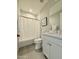 Bright bathroom featuring white subway tile, a shower/tub, and a modern vanity at 3669 E Boot Track Trl, Gilbert, AZ 85296