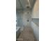 Modern bathroom features a stylish marble rain shower with a glass door and geometric patterned accent tiles at 3669 E Boot Track Trl, Gilbert, AZ 85296