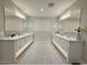 Bathroom featuring a double sink vanity with a large mirror and patterned floor at 3669 E Boot Track Trl, Gilbert, AZ 85296