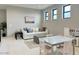 Open-concept bonus room with a play area and comfortable seating at 3669 E Boot Track Trl, Gilbert, AZ 85296
