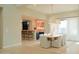 Dining area with large windows, views to the bar, and modern, neutral decor at 3669 E Boot Track Trl, Gilbert, AZ 85296