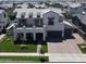 Beautiful home with a large balcony, well-manicured lawn, and a wide driveway at 3669 E Boot Track Trl, Gilbert, AZ 85296
