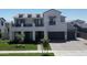 Well-manicured two-story home exterior showcasing a meticulously kept lawn and a charming facade at 3669 E Boot Track Trl, Gilbert, AZ 85296