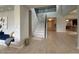 Grand foyer with high ceilings, staircase, and light wood flooring at 3669 E Boot Track Trl, Gilbert, AZ 85296
