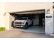 View of the home's garage, complete with truck, and ample storage at 3669 E Boot Track Trl, Gilbert, AZ 85296