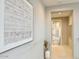 Hallway featuring a modern art piece and a glimpse into the bathroom at 3669 E Boot Track Trl, Gilbert, AZ 85296