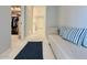 Hallway featuring an entry to the closet and bathroom with white carpet and blue accents at 3669 E Boot Track Trl, Gilbert, AZ 85296