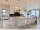 Stunning kitchen with marble island, pendant lighting, and stainless steel appliances at 3669 E Boot Track Trl, Gilbert, AZ 85296