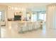 Bright kitchen boasts a center island, bar seating, stainless steel appliances, and an open layout at 3669 E Boot Track Trl, Gilbert, AZ 85296