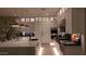 Modern white kitchen featuring a marble island, stainless steel appliances, and custom cabinets with glass displays at 3669 E Boot Track Trl, Gilbert, AZ 85296