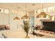 Bright kitchen featuring a large island, stainless steel appliances, and pendant lighting at 3669 E Boot Track Trl, Gilbert, AZ 85296