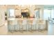 Bright kitchen featuring a large island, stainless steel appliances, and bar stool seating at 3669 E Boot Track Trl, Gilbert, AZ 85296