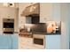 Gourmet kitchen featuring stainless steel appliances, custom cabinets, and elegant finishes at 3669 E Boot Track Trl, Gilbert, AZ 85296