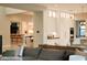 Inviting living room showcases an open floorplan and an adjacent kitchen and dining area at 3669 E Boot Track Trl, Gilbert, AZ 85296