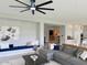 Bright living room with a large sectional, recessed lighting, and an open layout at 3669 E Boot Track Trl, Gilbert, AZ 85296