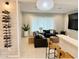 Cozy living room with neutral tones and custom wine rack at 3669 E Boot Track Trl, Gilbert, AZ 85296
