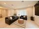 Inviting living room with leather furniture set and light-colored tile flooring at 3669 E Boot Track Trl, Gilbert, AZ 85296