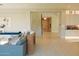 Open-concept living room featuring tile floors and a neutral color palette at 3669 E Boot Track Trl, Gilbert, AZ 85296