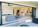Open living space with sliding glass doors to the patio and a modern aesthetic at 3669 E Boot Track Trl, Gilbert, AZ 85296