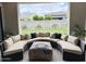 Inviting outdoor patio with stylish sectional seating and beautiful backyard views at 3669 E Boot Track Trl, Gilbert, AZ 85296