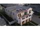Nighttime aerial shot showcasing the home's striking architectural details and inviting exterior lighting at 3669 E Boot Track Trl, Gilbert, AZ 85296