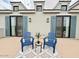 Inviting rooftop deck with blue chairs, a table, and stylish decor at 3669 E Boot Track Trl, Gilbert, AZ 85296