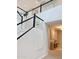 Modern staircase with glass railing and lots of natural light at 3669 E Boot Track Trl, Gilbert, AZ 85296