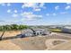 Aerial shot shows the architectural design of the modern house, ample land, and community at 3933 E Freeman Ln, San Tan Valley, AZ 85140
