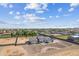 Wide aerial shot showcases a modern home with desert landscaping, surrounded by a block fenced yard at 3933 E Freeman Ln, San Tan Valley, AZ 85140