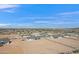 Expansive aerial view of new home construction, showcasing community layout and desert landscape at 3933 E Freeman Ln, San Tan Valley, AZ 85140