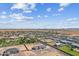 Expansive aerial view showcases a new neighborhood in the desert with mountain views in the distance at 3933 E Freeman Ln, San Tan Valley, AZ 85140