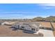 Aerial view of a modern single-Gathering home with desert landscaping and a spacious dirt backyard at 3933 E Freeman Ln, San Tan Valley, AZ 85140