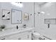Modern bathroom featuring a sleek vanity, black accents, and luxurious glass shower with tile surround at 3933 E Freeman Ln, San Tan Valley, AZ 85140