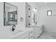 Bright bathroom featuring double sinks, black hardware, and plenty of counter space and natural light at 3933 E Freeman Ln, San Tan Valley, AZ 85140